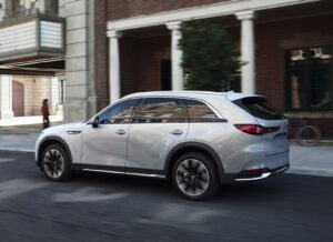 Mazda KK CX-90: white rear quarter, driving